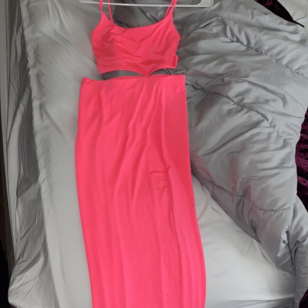 Really cute bright pink two-piece top and skirt!
